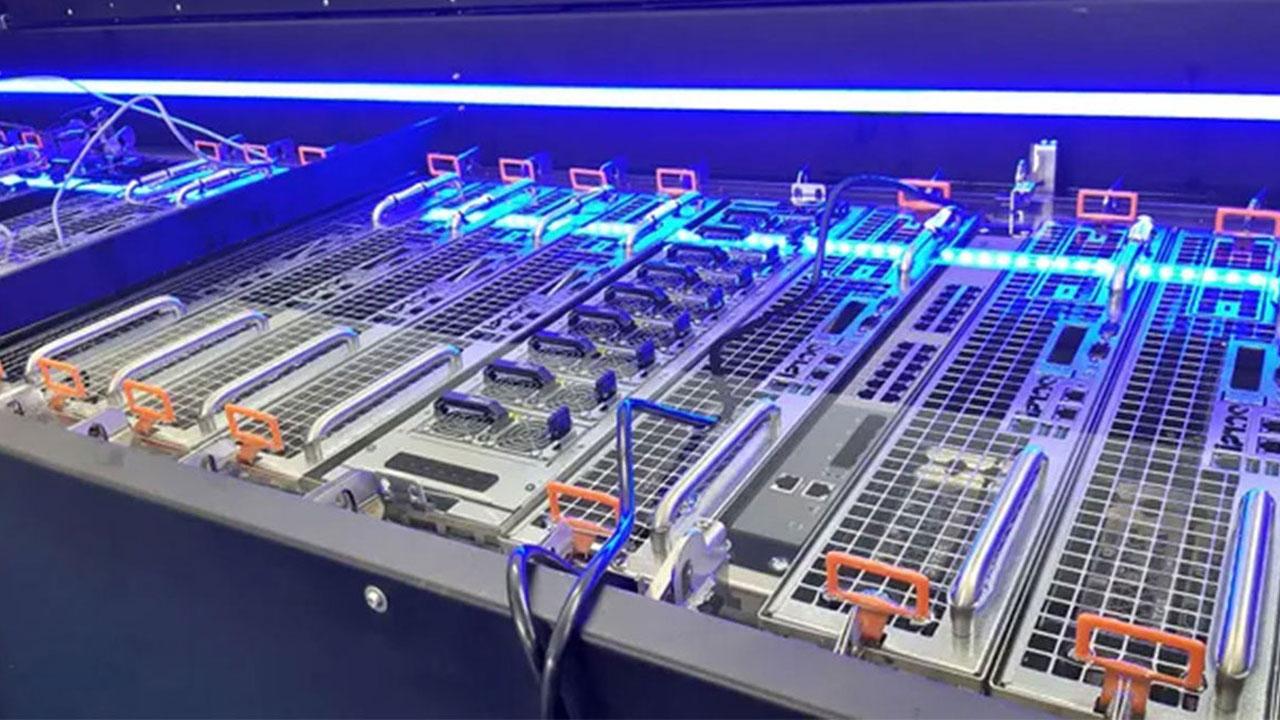 Row of data center servers with liquid cooling